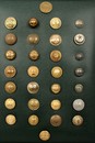 30 old french buttons in a frame. From 1804 till now.