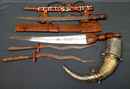  4 afrcan daggers and swords + powder flask Africa