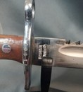 Swiss bayonet, 1914 type. Metal scabbard, leather hanger.