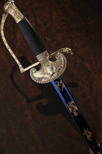 General/staff officer or dignitaries: 1 st Empire sword. Bronze colour . Sword of Napoleon in last movie of Ridley Scott