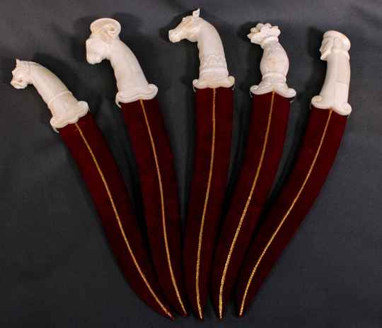 Dagger with camel bone handle and damascus blade, double curve, scabbard covered with red velvet. Handicraft production. Price by one