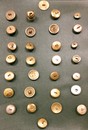 30 old french buttons in a frame. From 1804 till now.