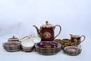 Tee/coffee cups + coffee/tee pot and all assorted plates, mainly on napoleonic thema