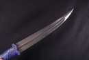Dagger with blue stone handle and wootz blade. Handicraft production. 