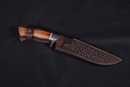 Bowie knife with damascus blade and leather scabbard. Handicraft production. 