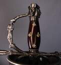 Rapier decorated with musketeers, unsuitable for fencing.