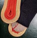 Cloverleaf epaulettes - Red center, gold sides. New old stock to finish. Produced by Ets David before 1960. The pair 