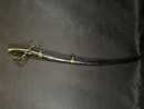 Light cavalry officer's saber, Empire. Blade engraved with a crowned eagle. Scabbard with brass fittings. 