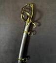 Light cavalry officer's saber, Empire/restoration. Blade engraved with blue and gold decoration. Scabbard with brass fittings.