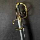 Light cavalry officer's saber, Empire/restoration. Blade engraved with blue and gold decoration. Scabbard with brass fittings.