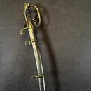 Light cavalry officer's saber, Empire/restoration. Blade engraved with blue and gold decoration. Scabbard with brass fittings.