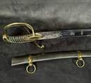 Light cavalry officer's saber, Empire/restoration. Blade engraved with blue and gold decoration. Scabbard with brass fittings.