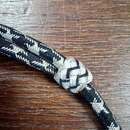 Sliding chin straps, black/silver. New old stock. Price per unit. WWII German?