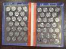 Set comprising an album of 49 U.S. state quarters plus 2  coin specimens.