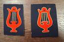 Musician's specialty badge. Red cut-out lyre, edged with gold thread, golden strings