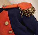 Child's naval officer's uniform, made around 1900, in an antique box.