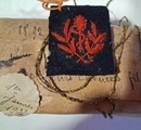 WWI. Pair of collar patches featuring a red caduceus on dark navy blue, 1892? New old stock.