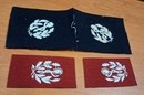 WWI. Pair of collar patches featuring a white caduceus on a black or madder-red background; new old stock.