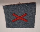 WWI machine-gunner's badge, red silk on horizon-blue background, new old stock.
