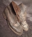 WWI. Civilian-issue ankle boots, not exactly new.
