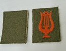 Military musician's badge: Red silk lyre on a khaki background.