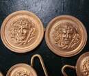 Lot of 47 belt plates featuring an anchor or the head of Medusa.
