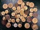 Lot of 47 belt plates featuring an anchor or the head of Medusa.
