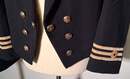Set of 2 British Merchant Navy officer's uniforms, including a ceremonial Spencer jacket, 
