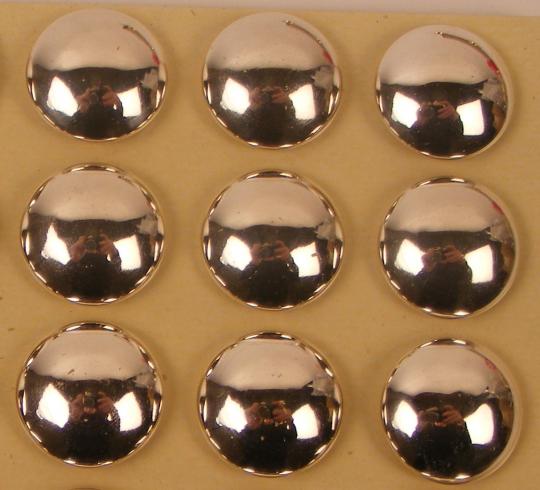 Buttons 25 mm diam. silver aspect. 1/2 curved. Price by one