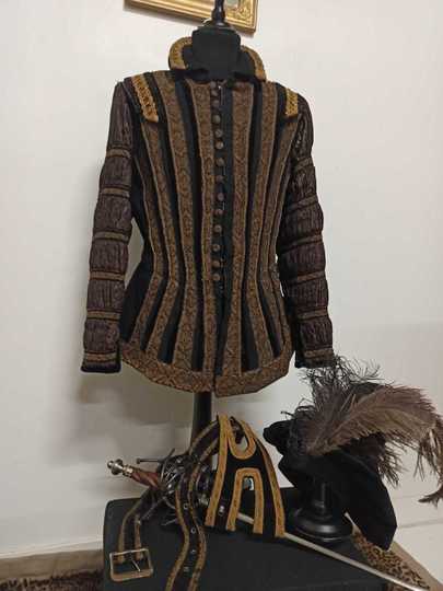 Renaissance jacket with hat and sword holder.