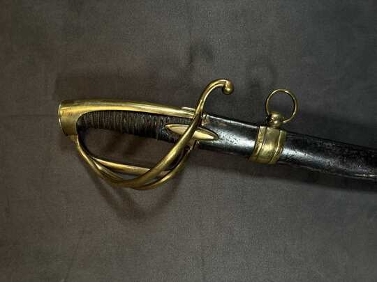 Light cavalry officer's saber, Empire. Blade engraved with a crowned eagle. Scabbard with brass fittings. 