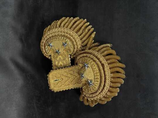 Pre-owned Major General's epaulettes (convertible to Brigadier General... or even Colonel); new condition, but with traces of glue.