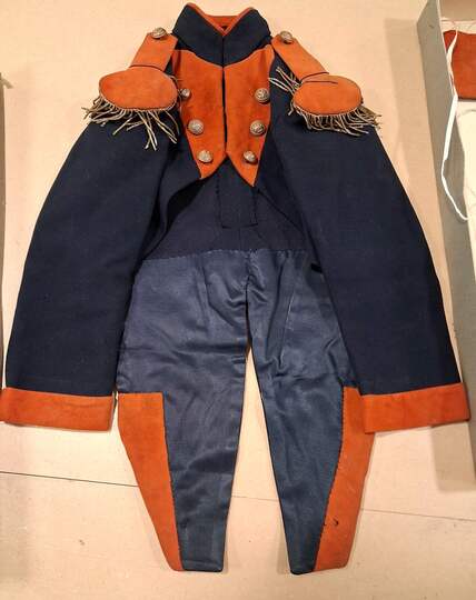 Child's naval officer's uniform, made around 1900, in an antique box.