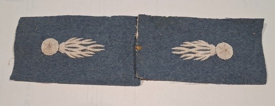 Pair of 60 mm white wool grenade patches on horizon-blue backing, new old stock. Only one pair in stock.