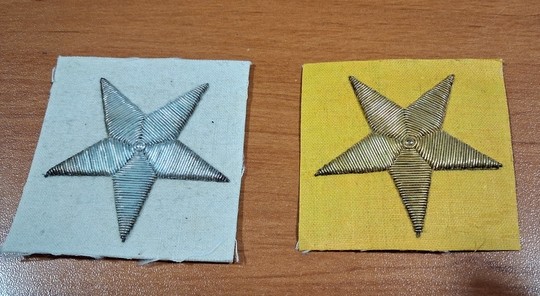 Gold or silver embroidered stars on a 52 x 52 mm canva background